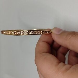 Gold in light pink accented bangle bracelet